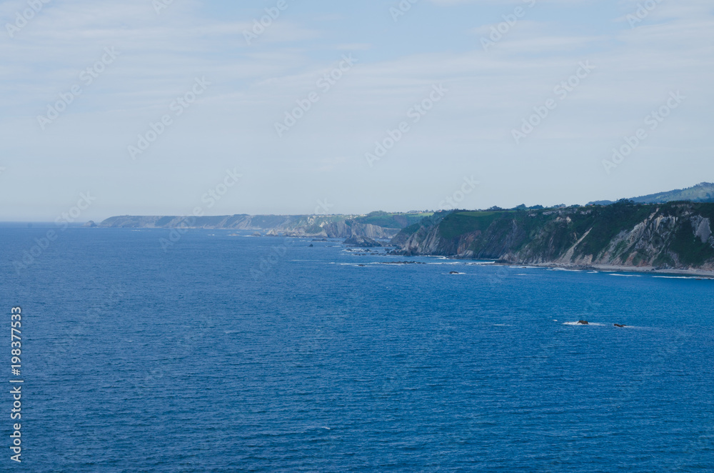 Coastal landscape with blue water.