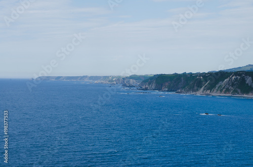 Coastal landscape with blue water.