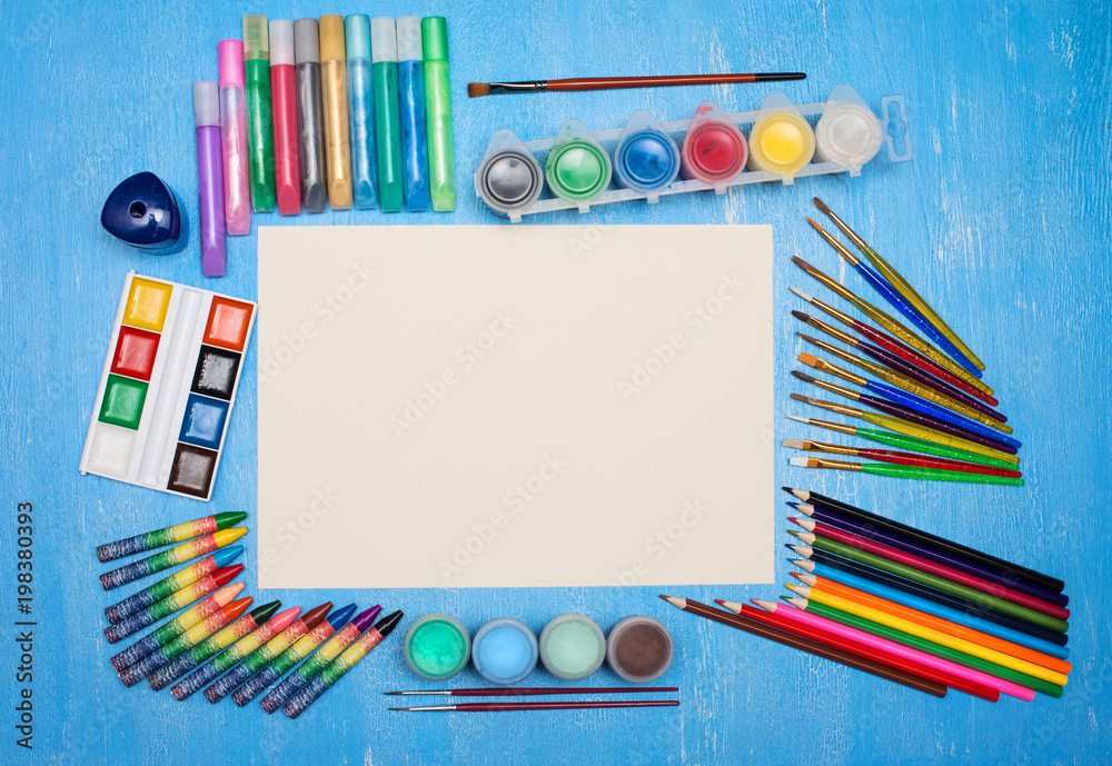 Colorful school art supplies on rustic wooden blue background with copy  space. Top view of arts and crafts table with various objects. Stock Photo  | Adobe Stock