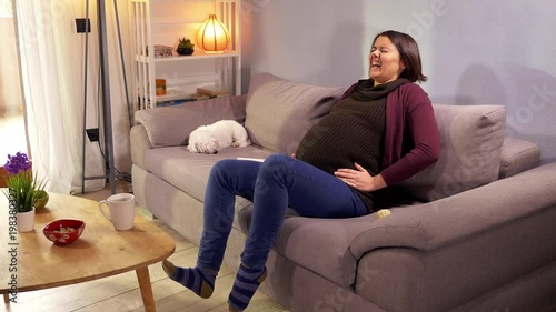 Beautiful pregnant woman feeling strong contractions asking for help calling husband