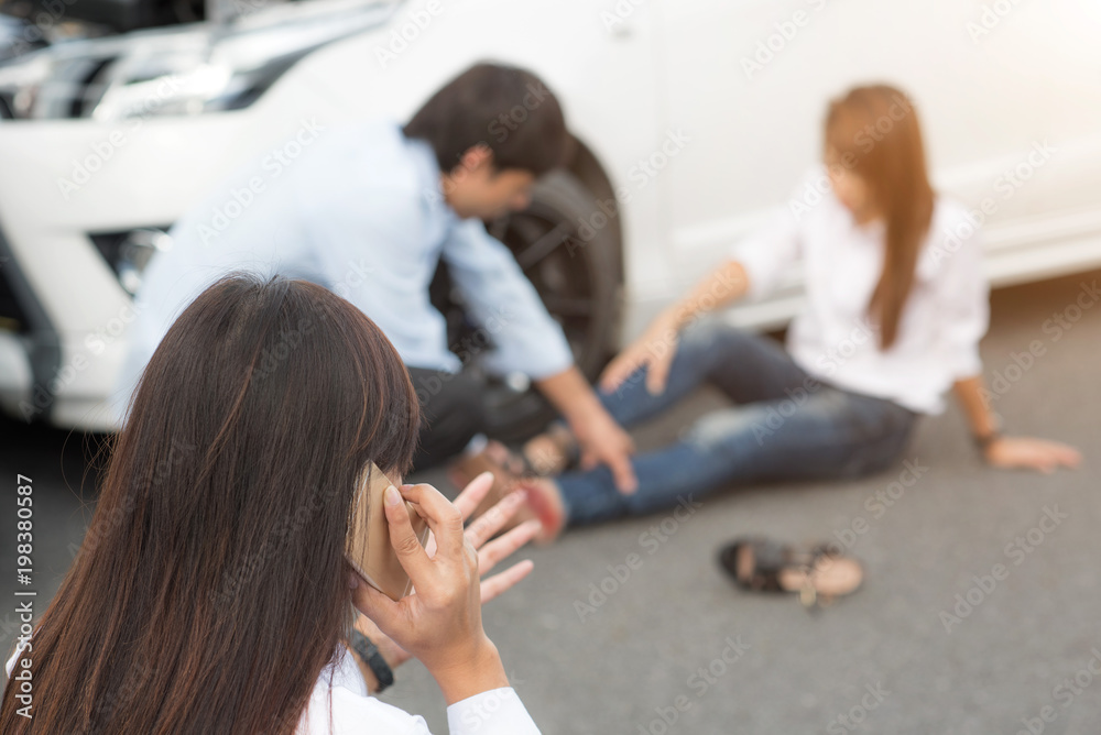 woman calls on mobile phone for emmergency help after car accident injured to one of party in wound need first aid woman calls on mobile phone for emmergency help after car accident injured to one of party in wound need first aid