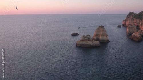 Aerial view of a boat sailing on the ocean photo