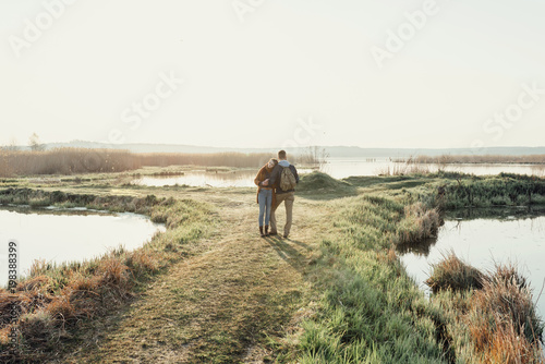 Young tourist couple at sunset sun