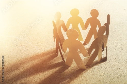 Konstfotografi Circle of paper people on paper background