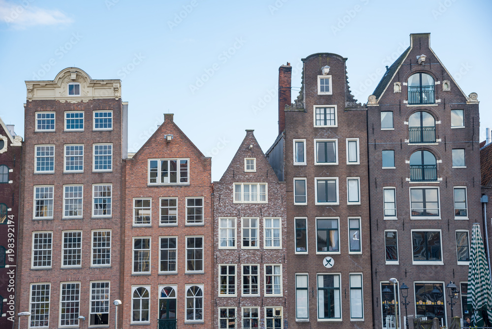 Traditional dutch buildings on canal in Amsterdam