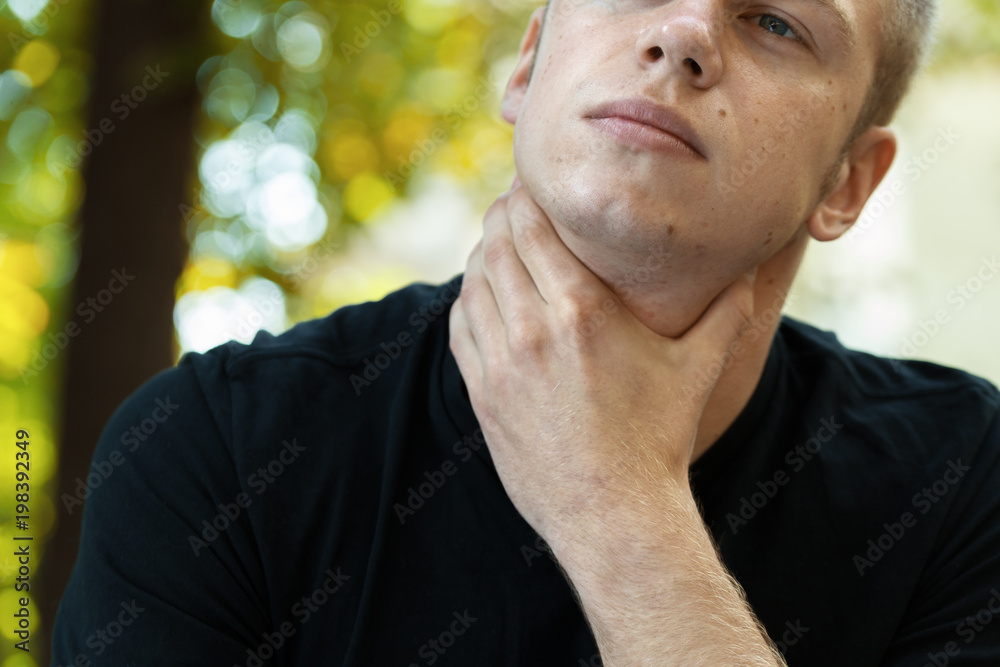 Fototapeta premium Young man with sore throat