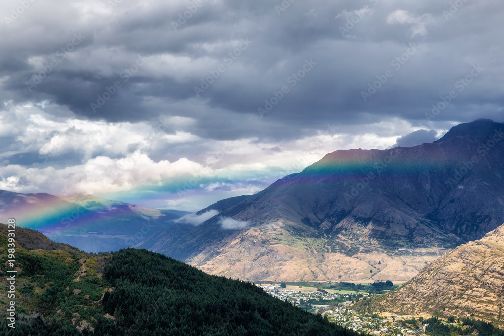 Rainbow in the mountains of Queenstown, South Island, New Zealand