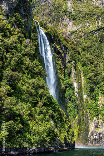 High waterfall in Milford Sound, picture taken from cruise ferry.