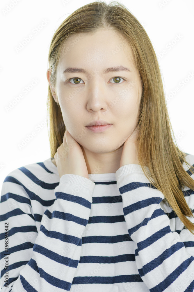 Smiling Asian young woman dressed in striped sweater isolated on white background. Smiling Asian young woman dressed in striped sweater isolated on white background.