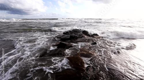 The sea at the end of winter in an area of Italy with dark volcanic sand