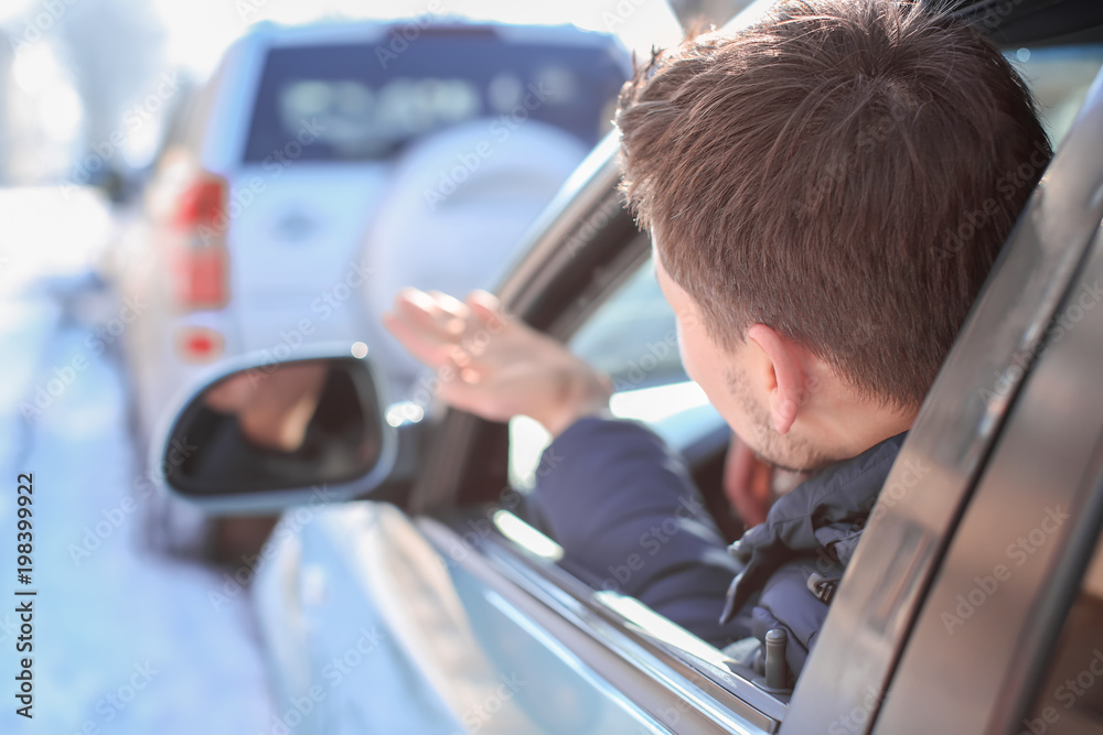 © Africa Studio - Emotional young man inside car in traffic jam © Africa Studio - Emotional young man inside car in traffic jam
