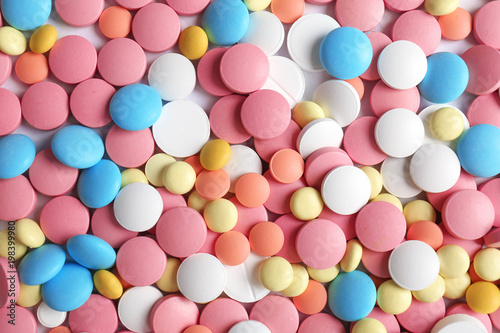 Many colorful pills as background