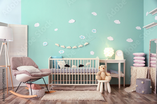 Photography Modern baby room interior with crib and rocking chair