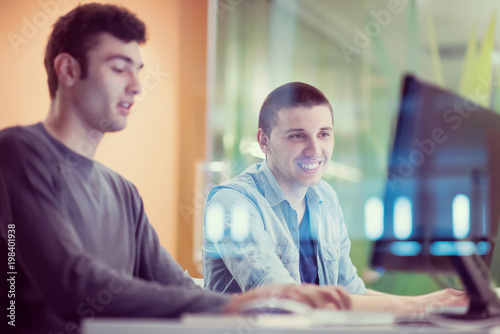 technology students group working in computer lab school classroom