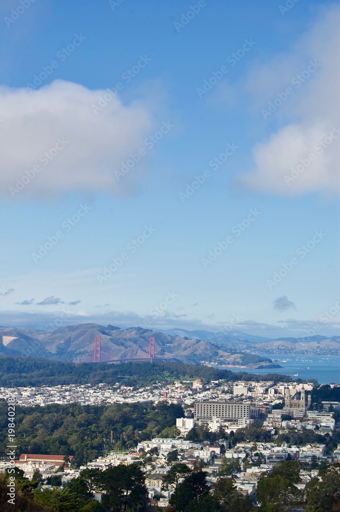 Beautiful aerial view from the San Francisco Twin Peaks overlooking the city's scenic skyline with numerous buildings and landmarks in the background - California, USA