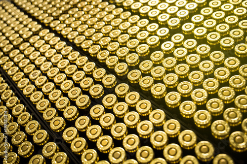 Print op canvas Hundreds of brass ammo rounds lined together