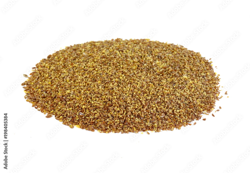 Ground or crushed brown flax seed or linseed isolated on white. Ground or crushed brown flax seed or linseed isolated on white.