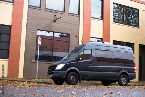 Commercial cargo mini van for small business and local delivery stand on the urban city street at industrial zone © vit