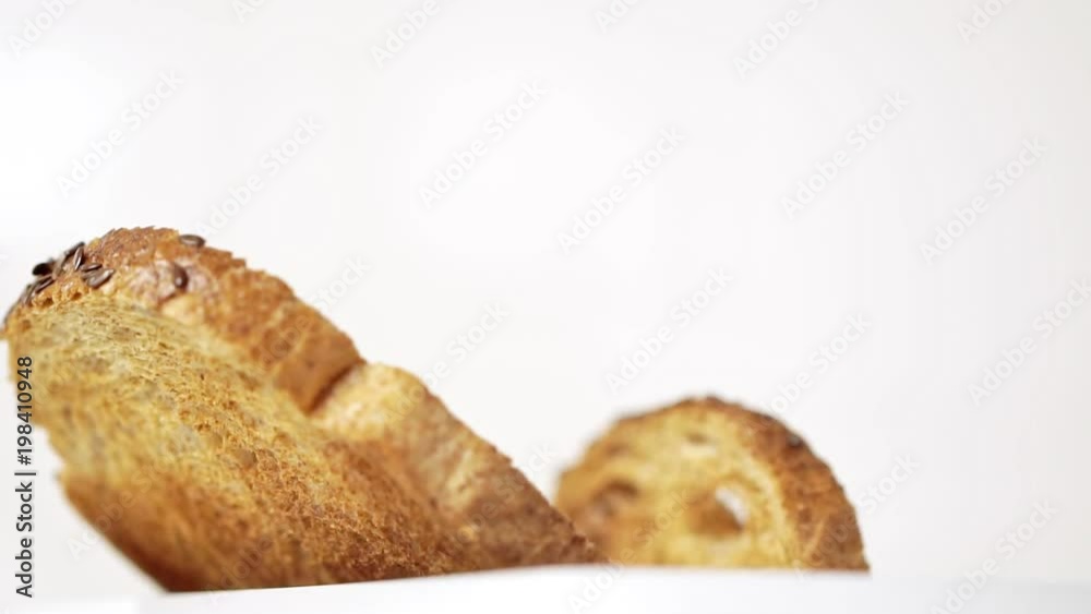 Roasted toast bread popping up from white modern toaster machine Roasted toast bread popping up from white modern toaster machine