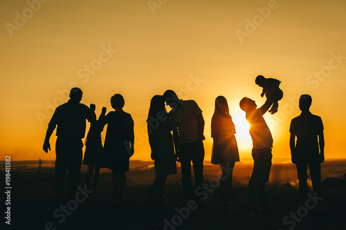 family and beautiful sunset