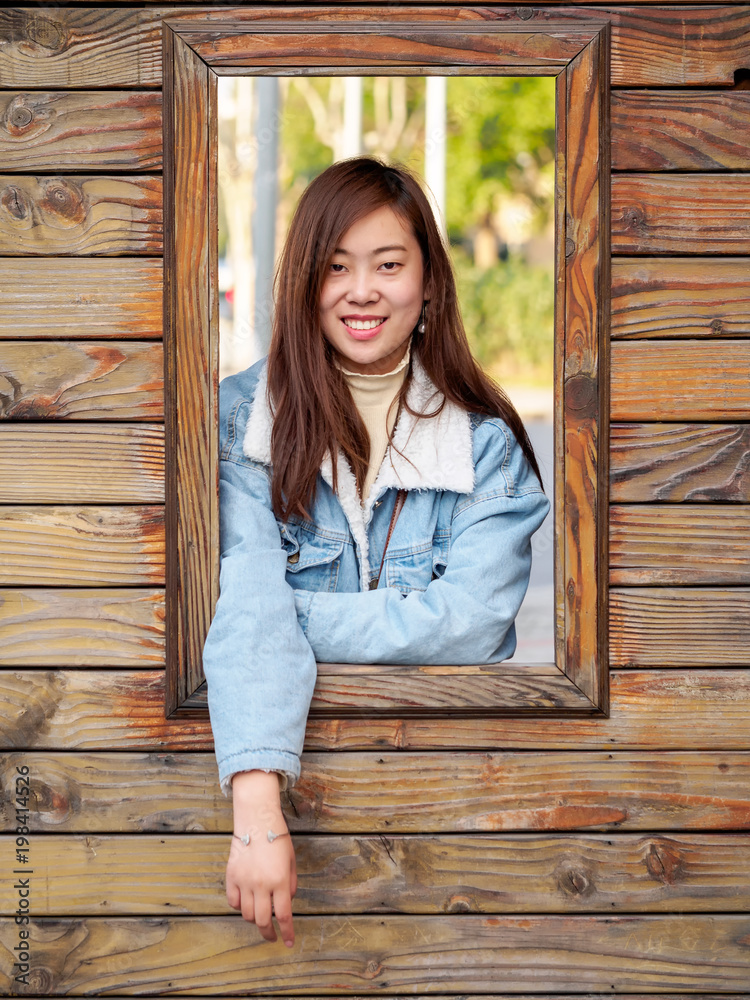 Outdoor portrait of young beautiful fashionable playful Chinese lady ...