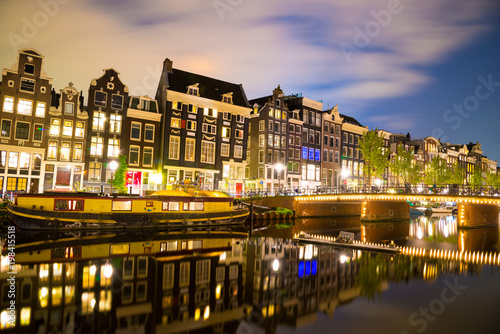 View of the Amsterdam canals and embankments along them at night