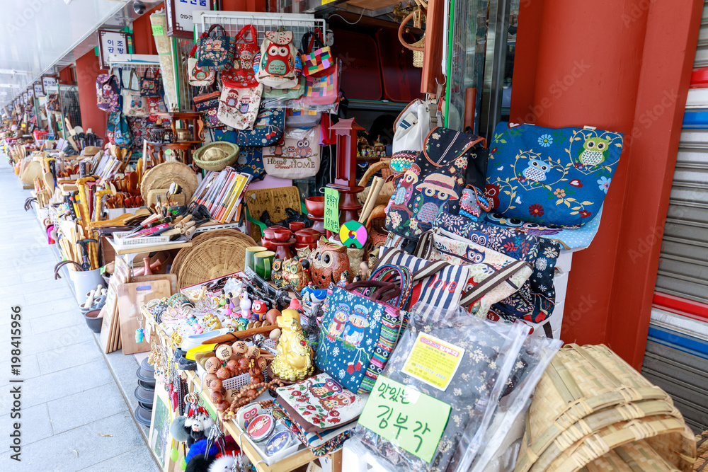 Street souvenir shops at Gwanghalluwon Pavilion in spring