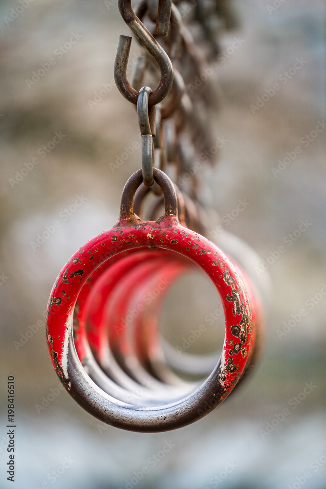 line up of red rusted steel rings