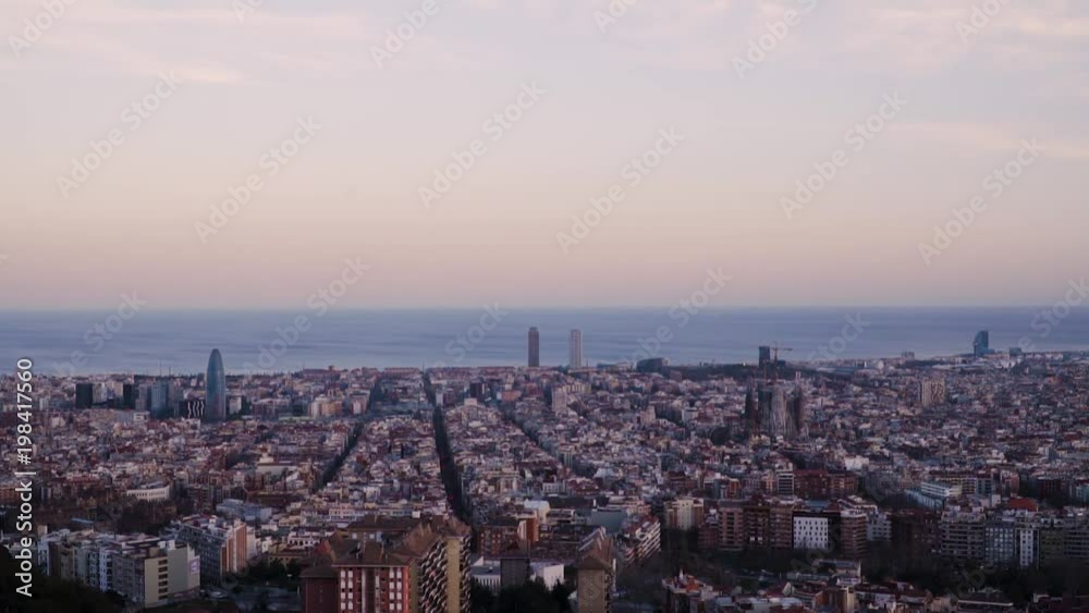 A time lapse of Barcelona, Spain. It is sunset time and the sun is almost gone. The Mediterranean sea is at the back. The view is taken from the antiaircraft refugee. A time lapse of Barcelona, Spain. It is sunset time and the sun is almost gone. The Mediterranean sea is at the back. The view is taken from the antiaircraft refugee.
