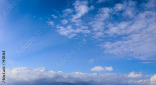 Spring. blue sky with fluffy white clouds. sun, sunlight, clouds, sky - spring changeable weather.
