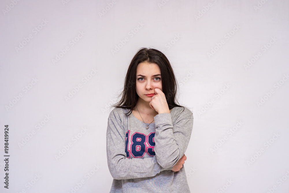 Cute brunette beautiful girl in different poses shows different emotions on different backgrounds in different clothes Cute brunette beautiful girl in different poses shows different emotions on different backgrounds in different clothes