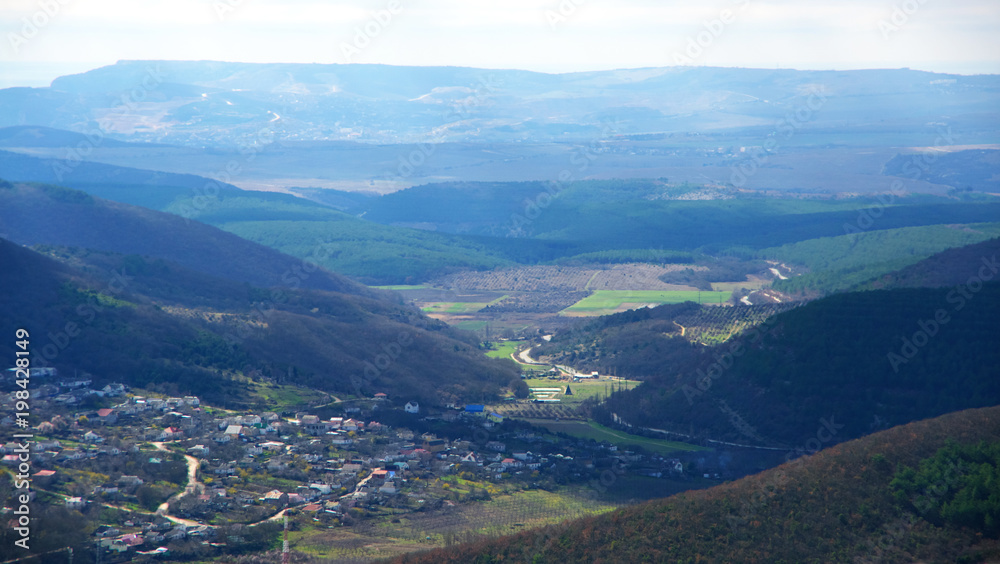 Village in valley among mountains