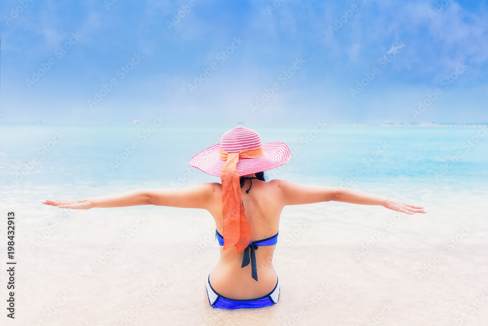 Young asian women in bikini on beach,relaxing,holiday,travel concept. Young asian women in bikini on beach,relaxing,holiday,travel concept.
