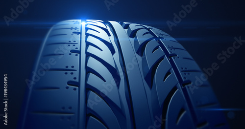 Close up car tire with depth of field and lens flare