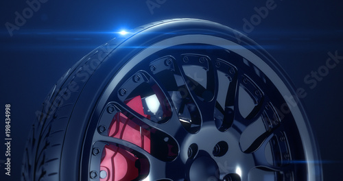 Close up sports car tire with lens flare