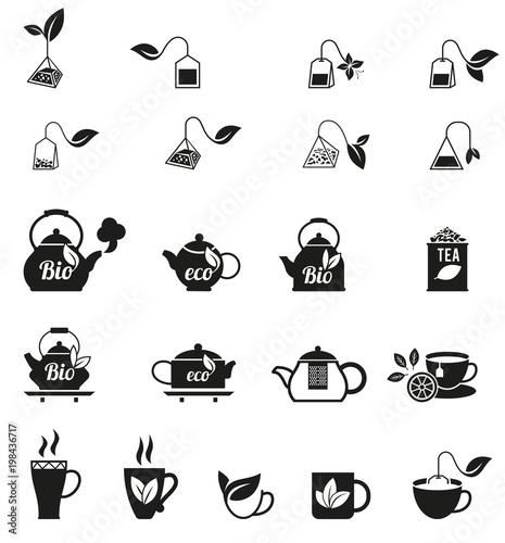 Cups of fresh tea and green leaves.