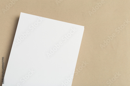 White business card on wooden table. Blank portrait A4. © fotofabrika