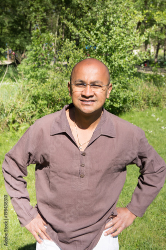 indian hispanic man in green park summer photo