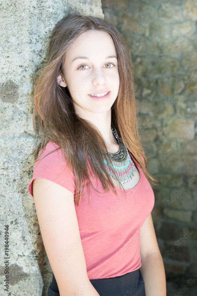 Young beauty model against wall outdoor