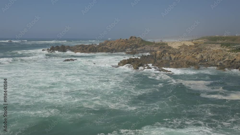 Waves crashing into rocks