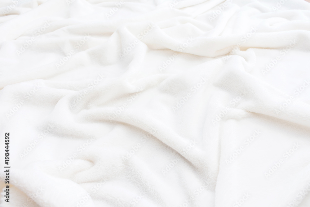 white, crumpled blanket, plaid, background with copy space, close up, top view white, crumpled blanket, plaid, background with copy space, close up, top view