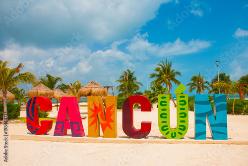 Cancun, Mexico, inscription in front of the Playa Delfines beach. Huge letters of the city name. photo