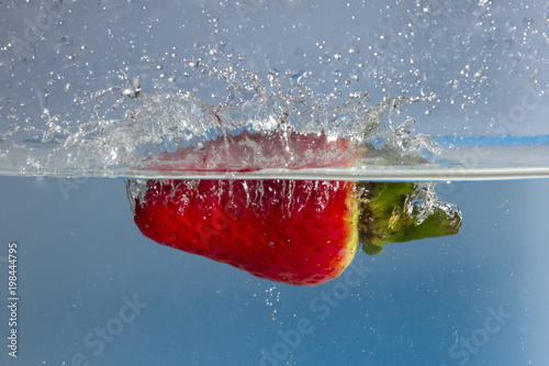 Strawberry splash in water photo