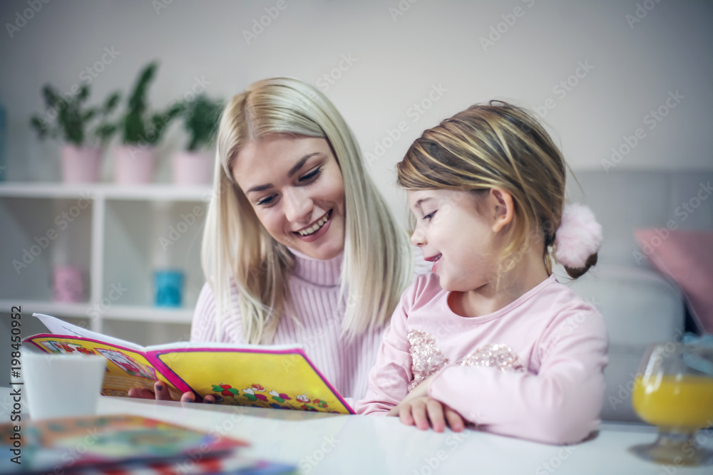 Mother reading book. Mother reading book.