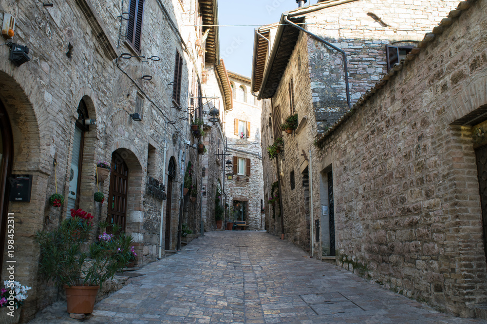 Quiet historic stone streets in the old town of Assisi, Umbria