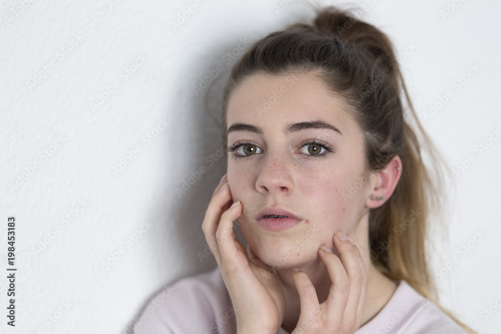 Studio portrait of a teenager. Vertical shot with natural light Studio portrait of a teenager. Vertical shot with natural light