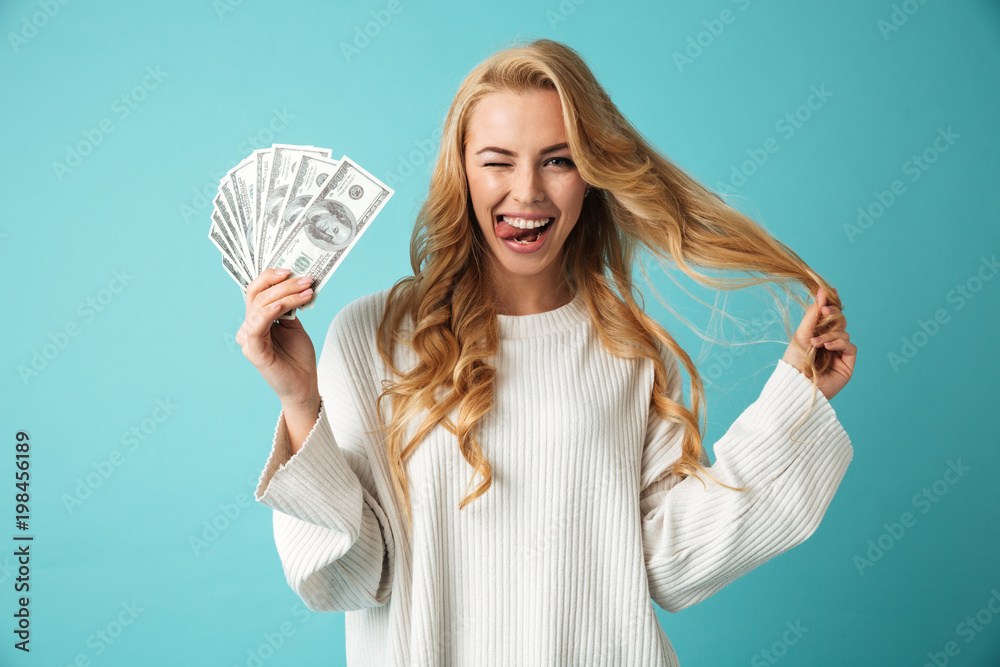 Portrait of a playful young blonde woman in sweater Portrait of a playful young blonde woman in sweater