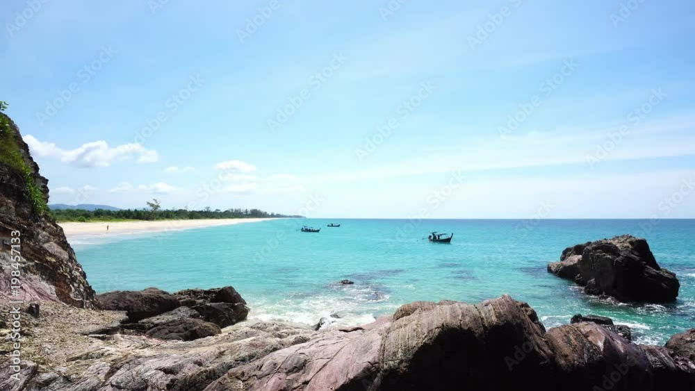 Thai Longtail fisherman boat at beautiful tropical sea scenery view in summer season Thai Longtail fisherman boat at beautiful tropical sea scenery view in summer season
