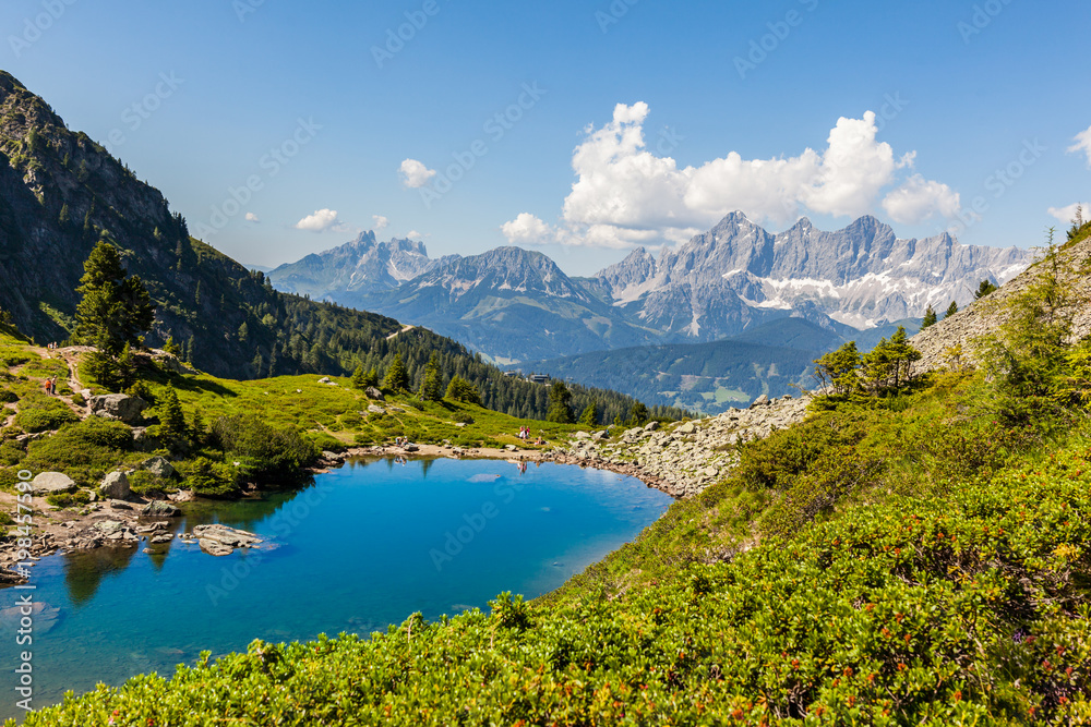 Lake Spiegelsee Mittersee and mountain range Dachstein in Austrian Alps