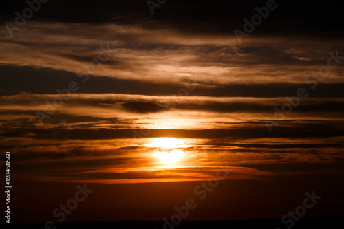 amazing sunset wallpaper. beautiful red sunset and clouds in orange sky  dramatic view. fascinating image. beautiful nature moments  breathtaking scenery